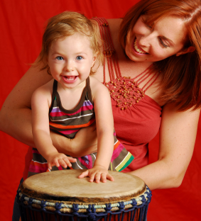 Girl Drumming with Her Mom